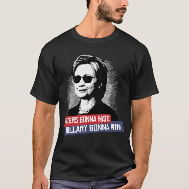 CAMISETA ENEMIGOS QUE VAN A ODIAR HILLARY QUE VA A GANAR (Anverso)