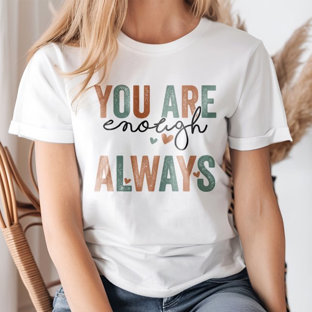 Camiseta "Eres Suficiente. "Siempre" letras retro grunge ("You Are Enough. Always" Retro Grunge Letters T-Shirt on a young woman.)