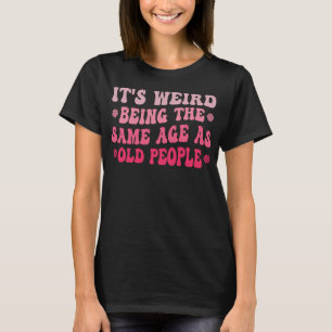 Camiseta Es raro ser de la misma edad que los ancianos rosa