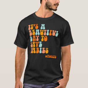Camiseta Es un bello día para salvar a los bebés por su vid