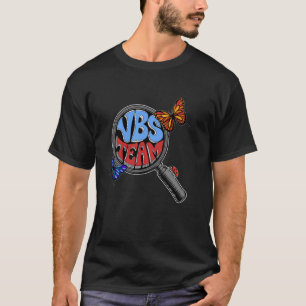 Camiseta Escuela Bíblica de Vacaciones 2025 VBS Equipo Lupa