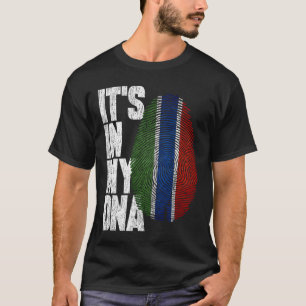 Camiseta Está en mi ADN Bandera gambiana orgullosa de Gambi