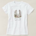 Camiseta Floral Cowgirl Bride Posse Floral Horseshoe<br><div class="desc">Round up your bride posse in style with this watercolor cowgirl boots tee—perfect for western-themed bachelorette weekends, rustic ranch getaways, or country-chic celebrations. Featuring soft floral horseshoe, and a custom script name, it’s made for brides and their friends who bring the boots and the beauty. Coordinate the crew and make...</div>