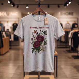 Camiseta floral inspiradora "Floreció, no rota"