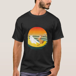 Camiseta Gato escalofriante en un gorra que sostiene banana