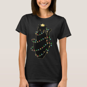 Camiseta Gato negro de Santa enredado en luz de árbol de Na