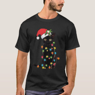 Camiseta Gato negro de Santa enredado en luz de árbol de Na