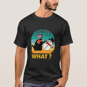 Camiseta Gato negro divertido empujando al muñeco de nieve