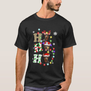 Camiseta Ho Ho Ho Ho Doberman Santa Hat ilumina a Cristo re