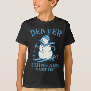 Camiseta Hombre de nieve sonriendo y esquiando en Denver Co