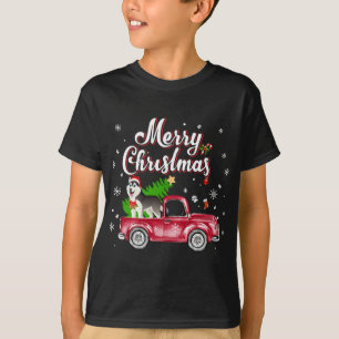 Camiseta Husky Retriever monta Navidades de camiones rojos