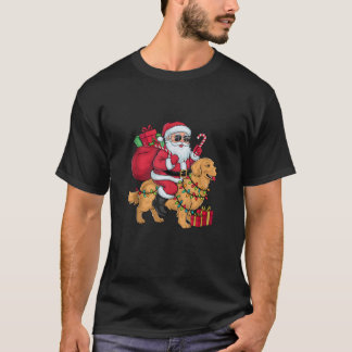 Camiseta Iluminación de Navidad Santa montando perro Retrie