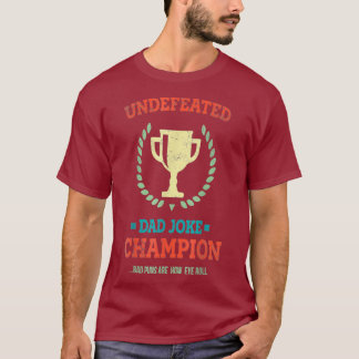 Camiseta Invencible Día de los Malos Puns, campeón del Chis