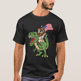 Camiseta Jesus Riding A Tyrannosaurus Rex Dinosaur USA Flag