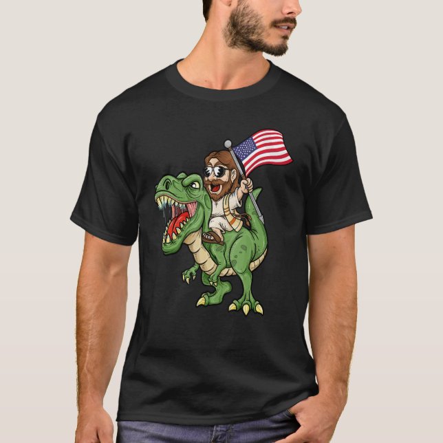 Camiseta Jesus Riding A Tyrannosaurus Rex Dinosaur USA Flag (Anverso)