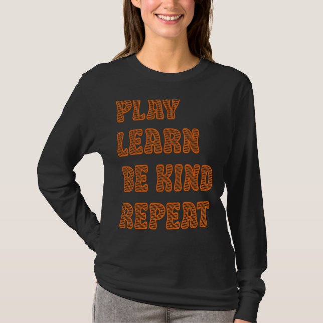 Camiseta Jugar Aprender a ser amable Repetir el Día de la A (Anverso)