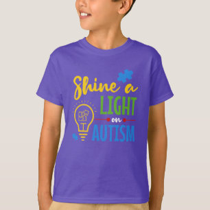 Camiseta La Conciencia Del Autismo Brilla Un Apoyo Ligero