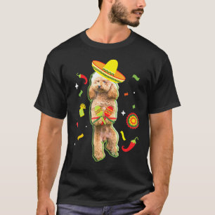 Camiseta La dueña del perro caniche cuece a los hombres muj