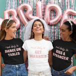 Camiseta La Fiesta De La Bachillerato Probablemente Se Case<br><div class="desc">¡Traiga un toque de alegría a las fiestas de la soltera con este encantador diseño de camisetas de personalizable! Con la frase perfectamente apropiada "lo más probable es que se CASE" con delicadas letras rosadas en un fondo blanco y nítido, este diseño es a la vez dulce y elegante. Es...</div>