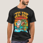 Camiseta La Temporada De Verano Sea-Sun Santa Beach Christm<br><div class="desc">Sumérjase en el espíritu del sol-mar con nuestros Navidades "Tis The Sea-Sun" en la colección de julio. Santa vende nieve por arena,  y te invitan a unirte a la diversión festiva del verano. 🌊 🎅 🏖️.</div>