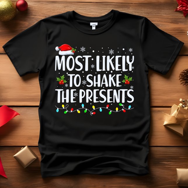Camiseta Lo más probable es que sacuda la DIVISA de los act (Wear this funny outfit at christmas dinner or party most likely to shake the presents)