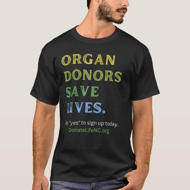 CAMISETA LOS DONANTES DE ÓRGANOS SALVAN VIDAS—EL NEGRO DE L (Anverso)