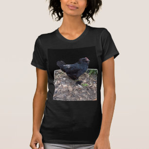 Camiseta "Madrugada de plumas: Un pollo negro en el arte de