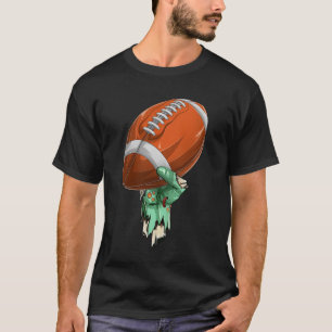Camiseta Mano de roca zombie sosteniendo fútbol americano d