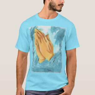 Camiseta Manos rezando (fondo azul)