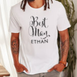 Camiseta Mejor Boda personalizado de escritura negra de hom<br><div class="desc">La camiseta del boda Best Man presenta escritura moderna de caligrafía giratoria negra con elegante texto de nombre de personalizado que puede personalizar. ¡Vea nuestros diseños coordinados de la fiesta nupcial!</div>