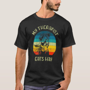 Camiseta Mi terapeuta come heno montando a caballo jockey H