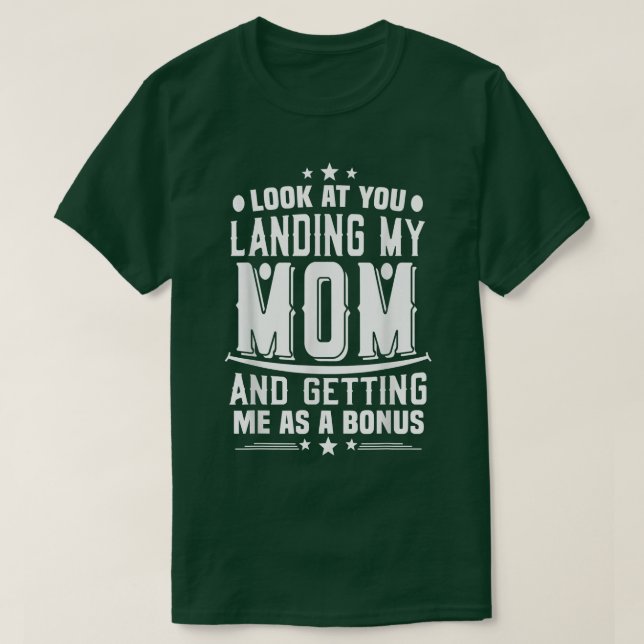 Camiseta Mira Que Aterrizas A Mi Mamá Consiguiéndome Como U (Diseño del anverso)