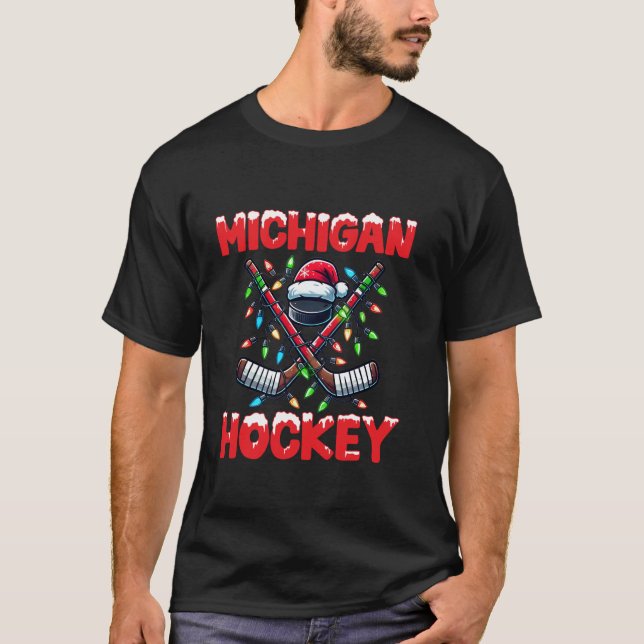 Camiseta Navidades de palillos de hockey de Michigan alumbr (Anverso)