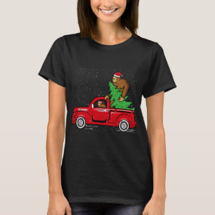 Camiseta Navidades de Santa Bigfoot Riding Red Truck Sasqua