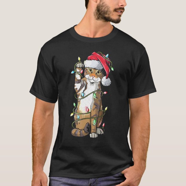 Camiseta Navidades Gorras del gato Santa Claus alumbran a c (Anverso)