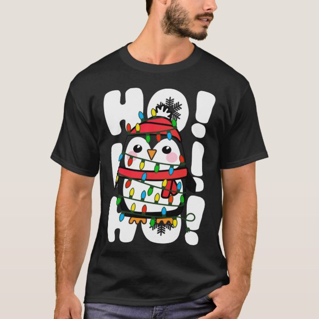 Camiseta Navidades Ho Ho Ho Ho iluminan el pingüino (Anverso)
