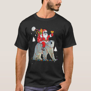 Camiseta Navidades Santa Claus montando luces de oso polar 