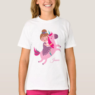 Camiseta Niña linda de pelo rubio montando un unicornio