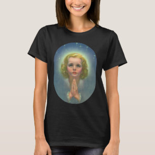 Camiseta Niña rubia angelical con halo y estrellas rezando