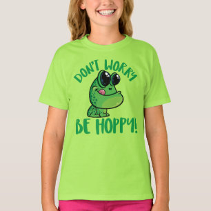 Camiseta No te preocupes, sé feliz rana sonriente de dibujo