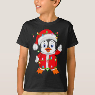 Camiseta Nochebuena pingüino iluminando el pingüino Cristo