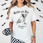 Camiseta Novia O Muerte Hasta La Muerte Fiesta Bachelorette<br><div class="desc">Prepárate para poner la cabeza en tu despedida de soltera con la novia o muere hasta morir Fiesta Bachelorette T-Shirt. Con una mano de esqueleto llamativa sosteniendo un martini, esta camisa encarna perfectamente la vibrante y juguetona atmósfera de un boda gótico o celebración temática de Halloween. Es la mezcla definitiva...</div>