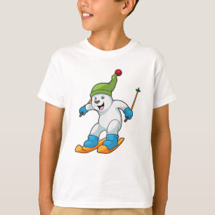 Camiseta Oso polar como esquiador con esquís y gorro de pom