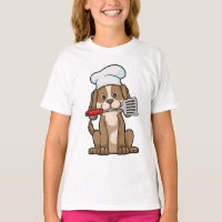 Perro cocinado con el gorra y la espátula del chef