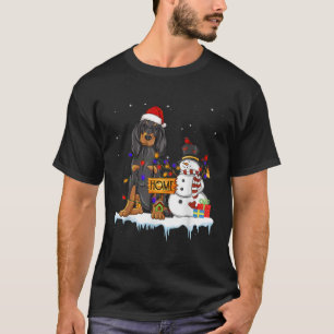 Camiseta Perro negro y moreno con Navidades Gorra