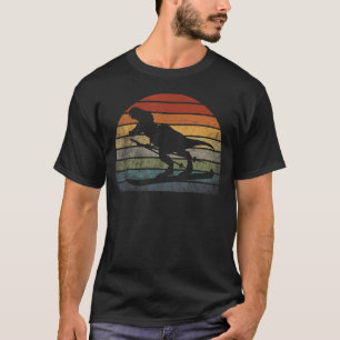 Camiseta Personaje de T rex esquí Dinosaurio con bufanda Es