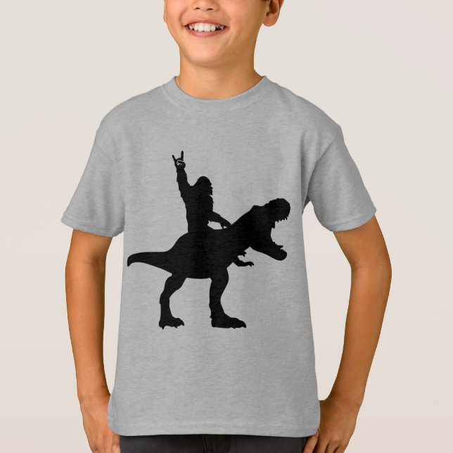 Camiseta Pie Grande montando T-Rex   (Anverso)