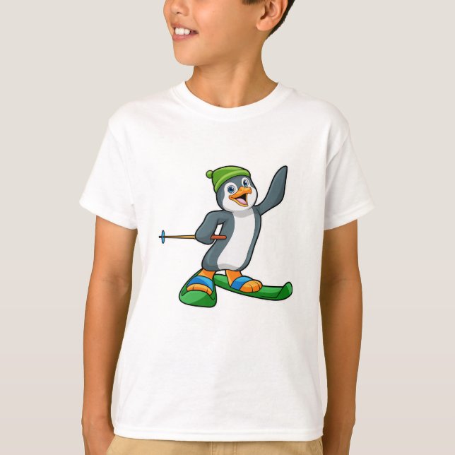 Camiseta Pingüino como esquiador con pista de esquí y gorro (Anverso)