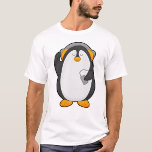 Camiseta Pingüino y teléfono móvil con auriculares