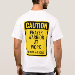 Camiseta PRECAUCIÓN Guerrero de Oración Milagros Divertido